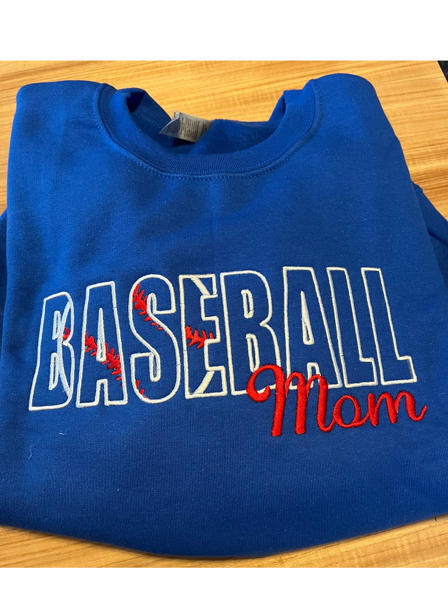 Embroidered crew neck sweatshirt.  Other sports available.